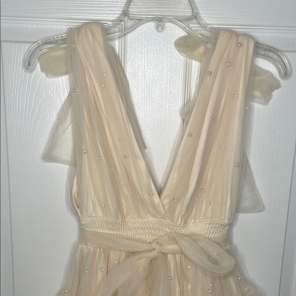 Cream Fit and Flare Mini Dress with Flutter Sleeves - Picture 3 of 9